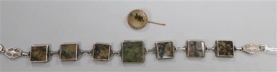A sterling white metal and moss agate panel bracelet and a moss agate stick pin.